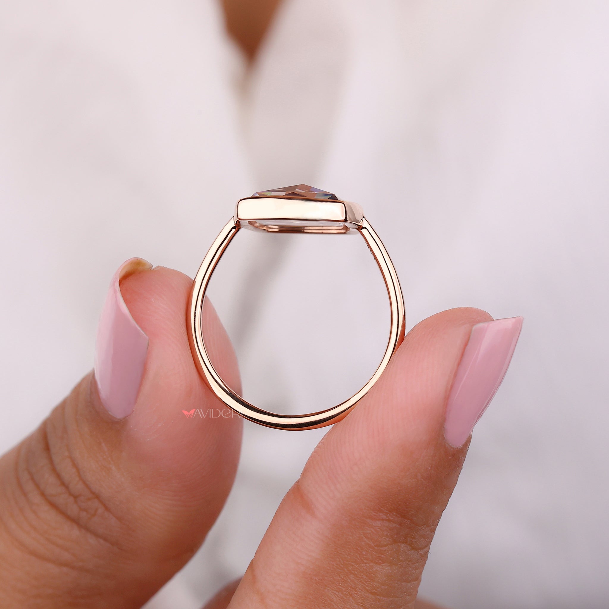 Elevate your style with a bezel setting ring that blends bold lines and protection.