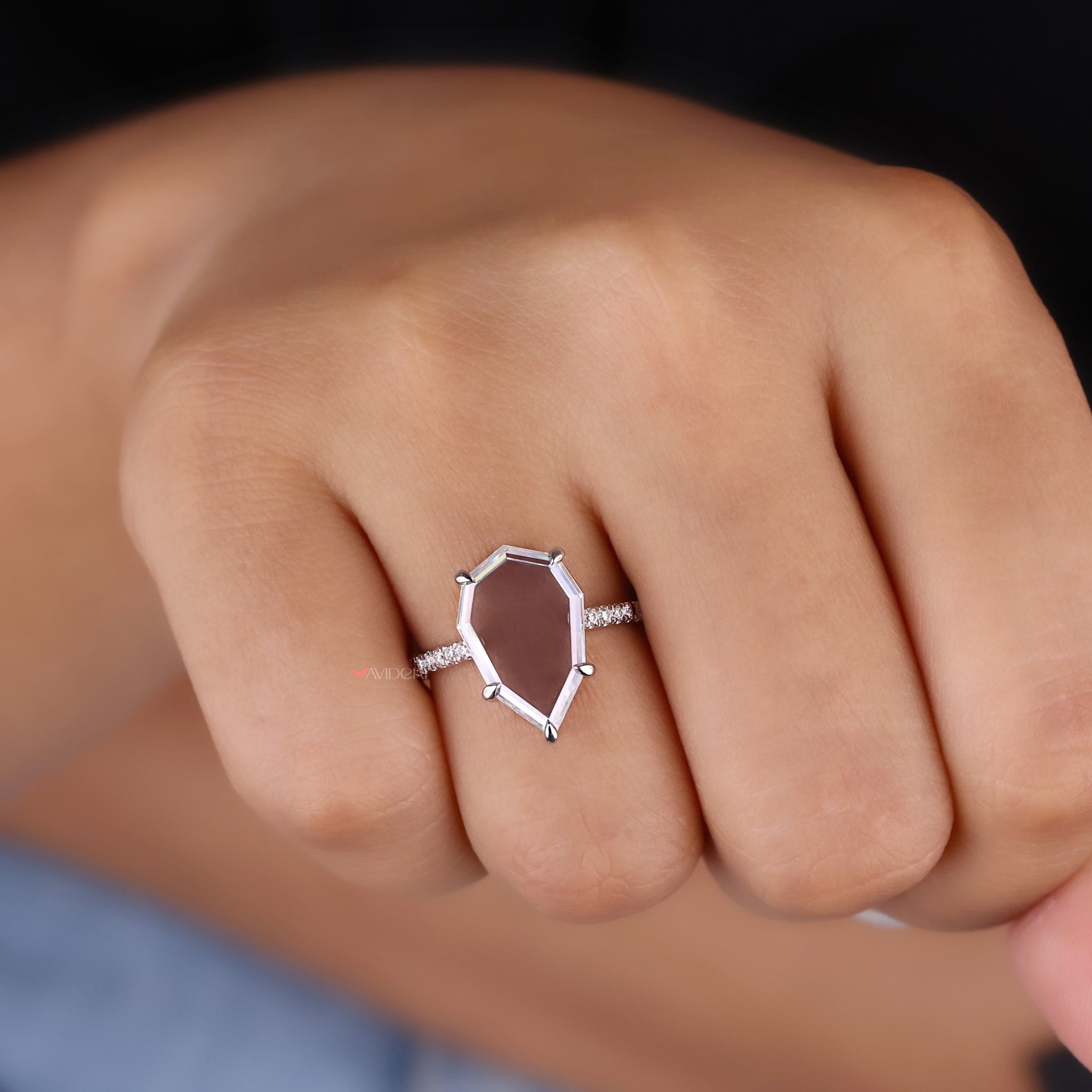 Classic round cut ring with a sparkling moissanite stone.