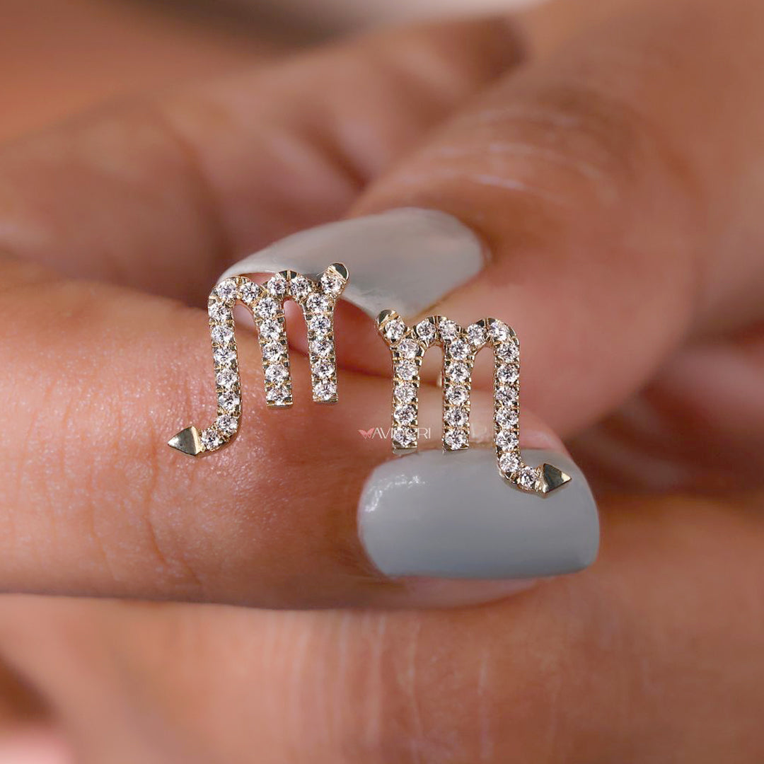 Round diamond earrings with a subtle zodiac touch