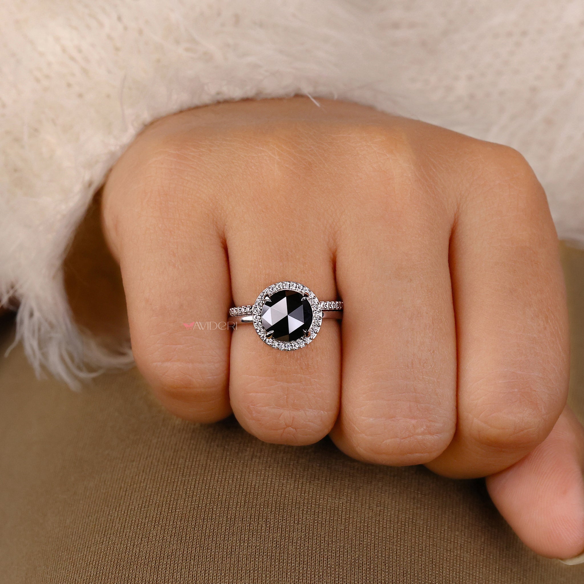 Halo ring setting with a round rose cut moissanite engagement ring.