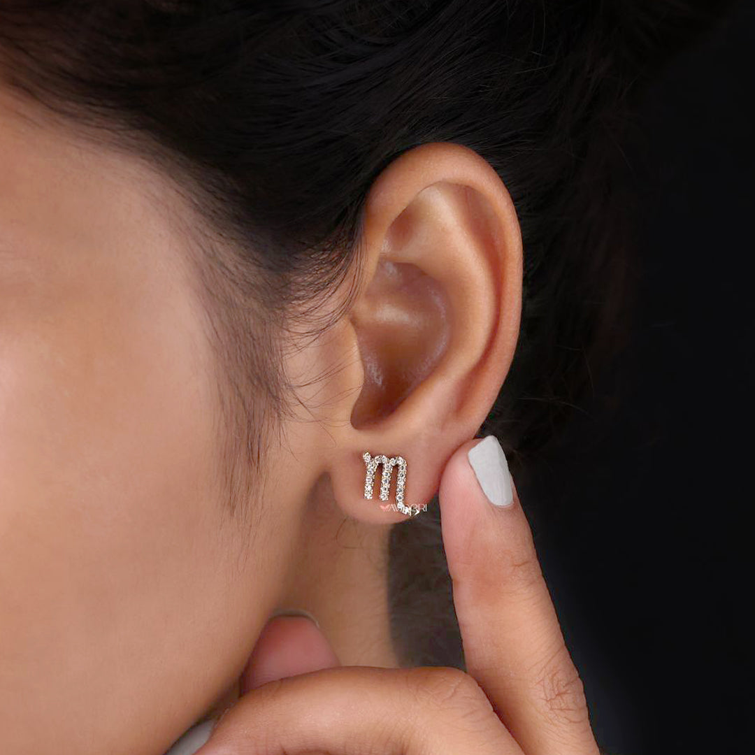 Yellow gold Scorpio zodiac earrings with symbolic charm