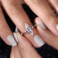 This marquise and round ring features a delicate, elegant design with distinct shapes in perfect harmony.