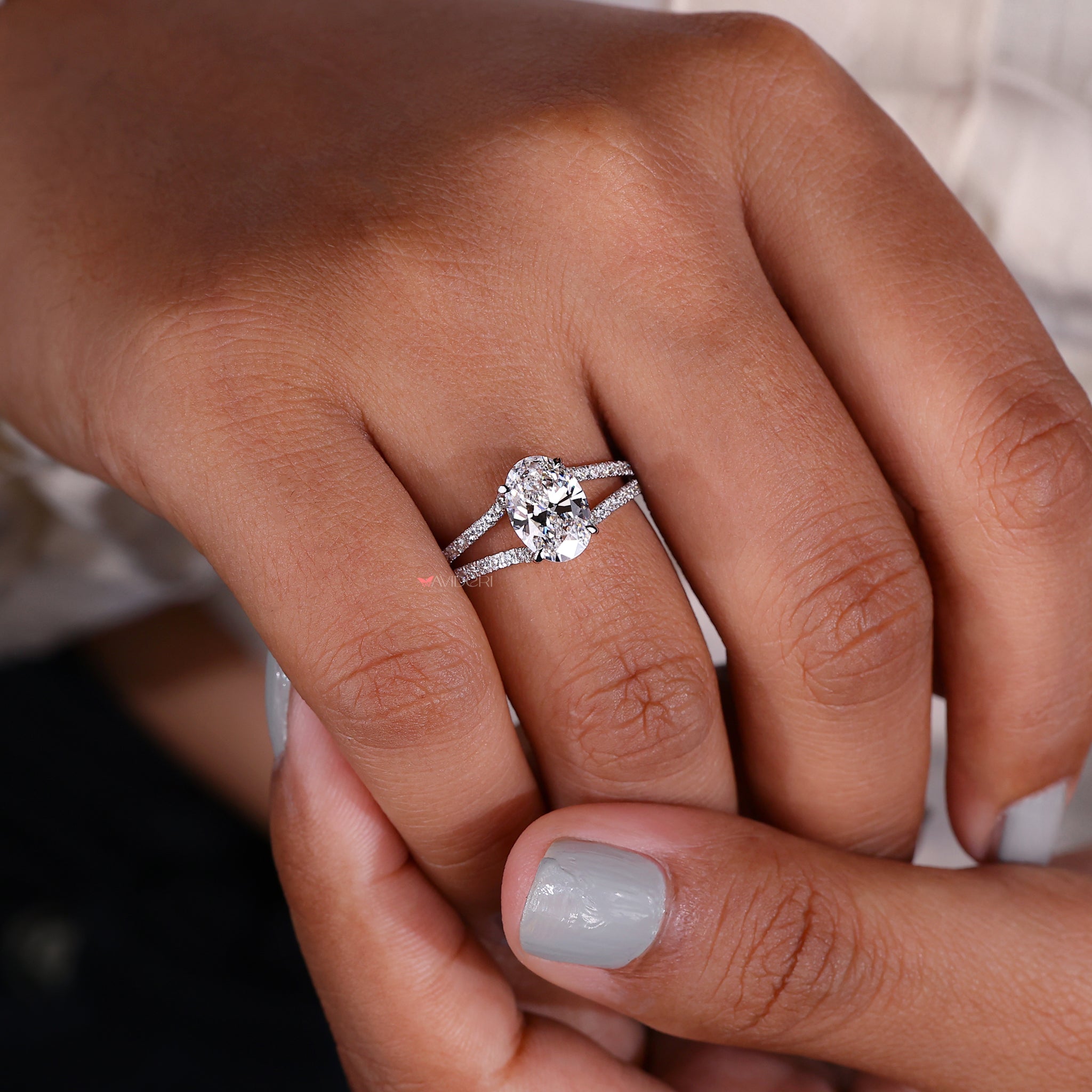 Engagement ring hidden halo style, featuring a subtle yet striking sparkle that complements any outfit.