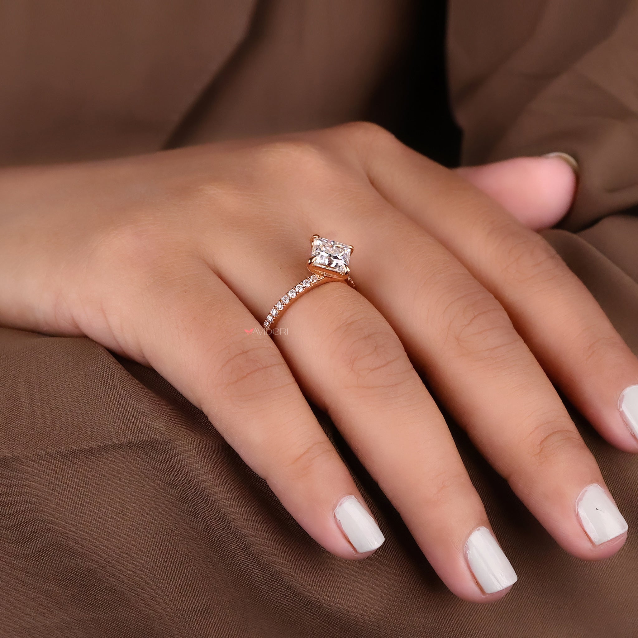 A custom engagement ring with unique stone and band design.