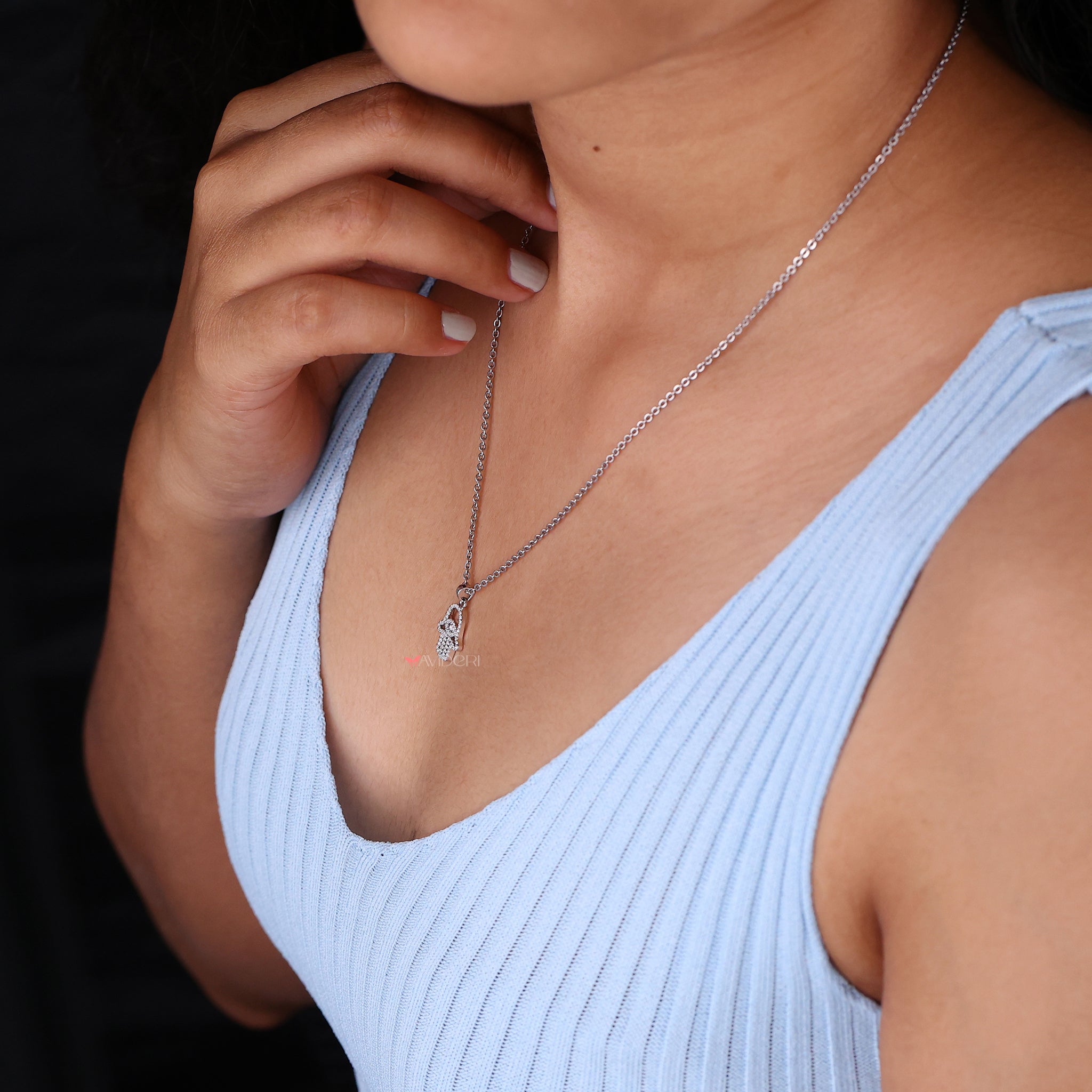 Hamsa Pendant Featuring Round Cut Moissanite