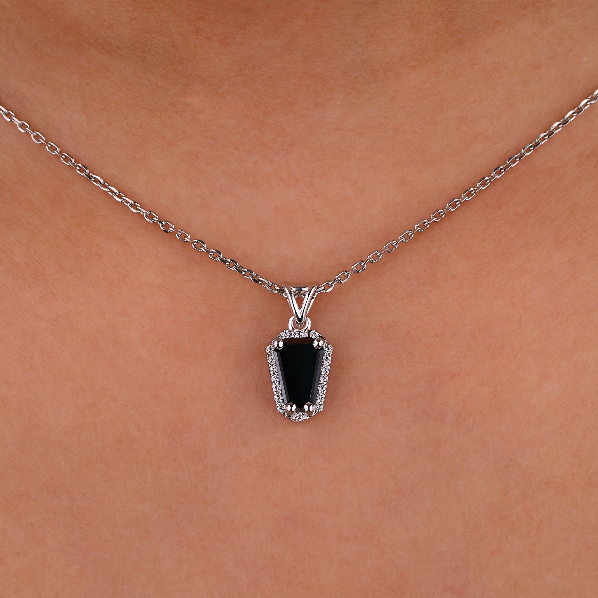 Moissanite pendant necklace featuring a unique coffin pendant design.
