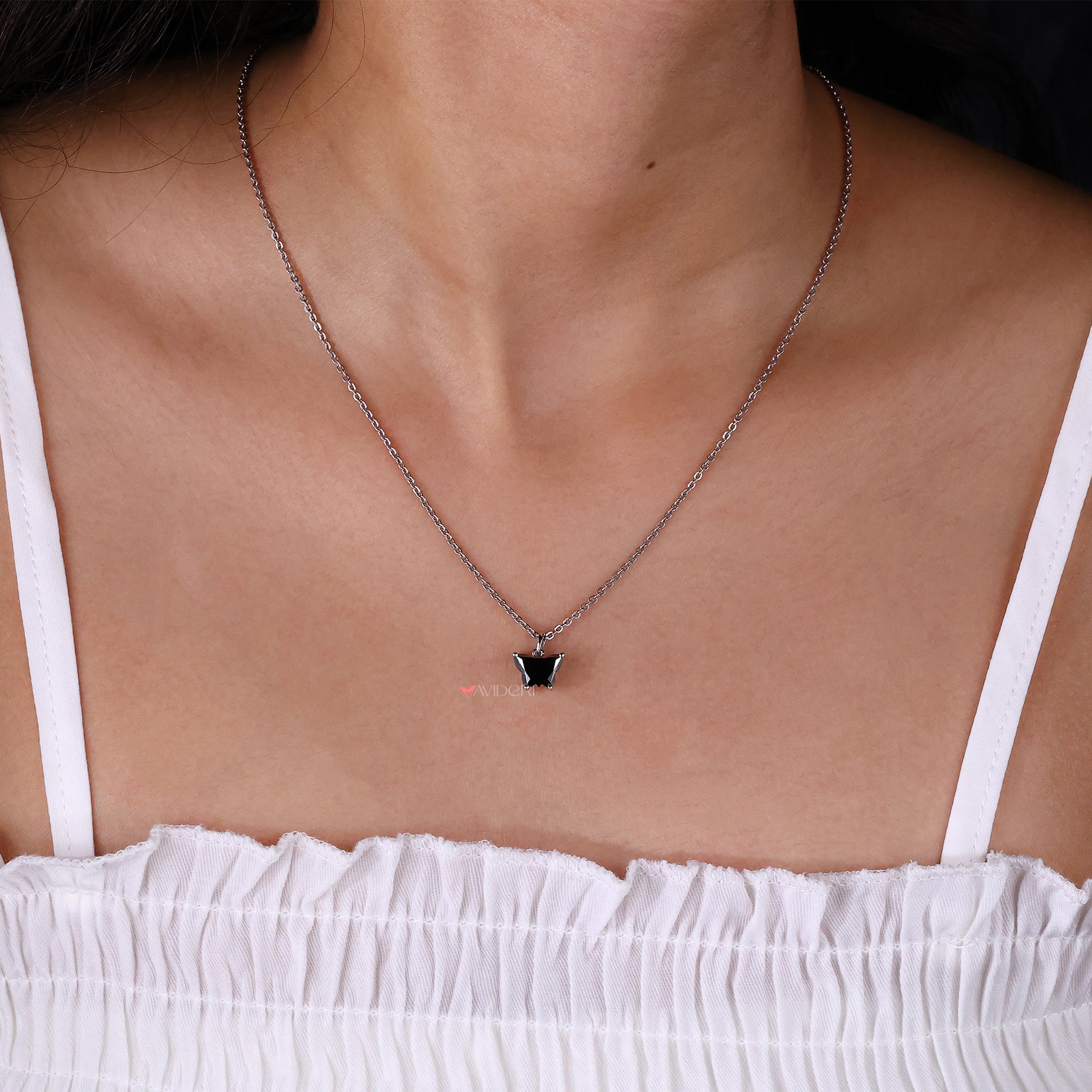 Custom moissanite pendant in butterfly design set in gold for elegance.