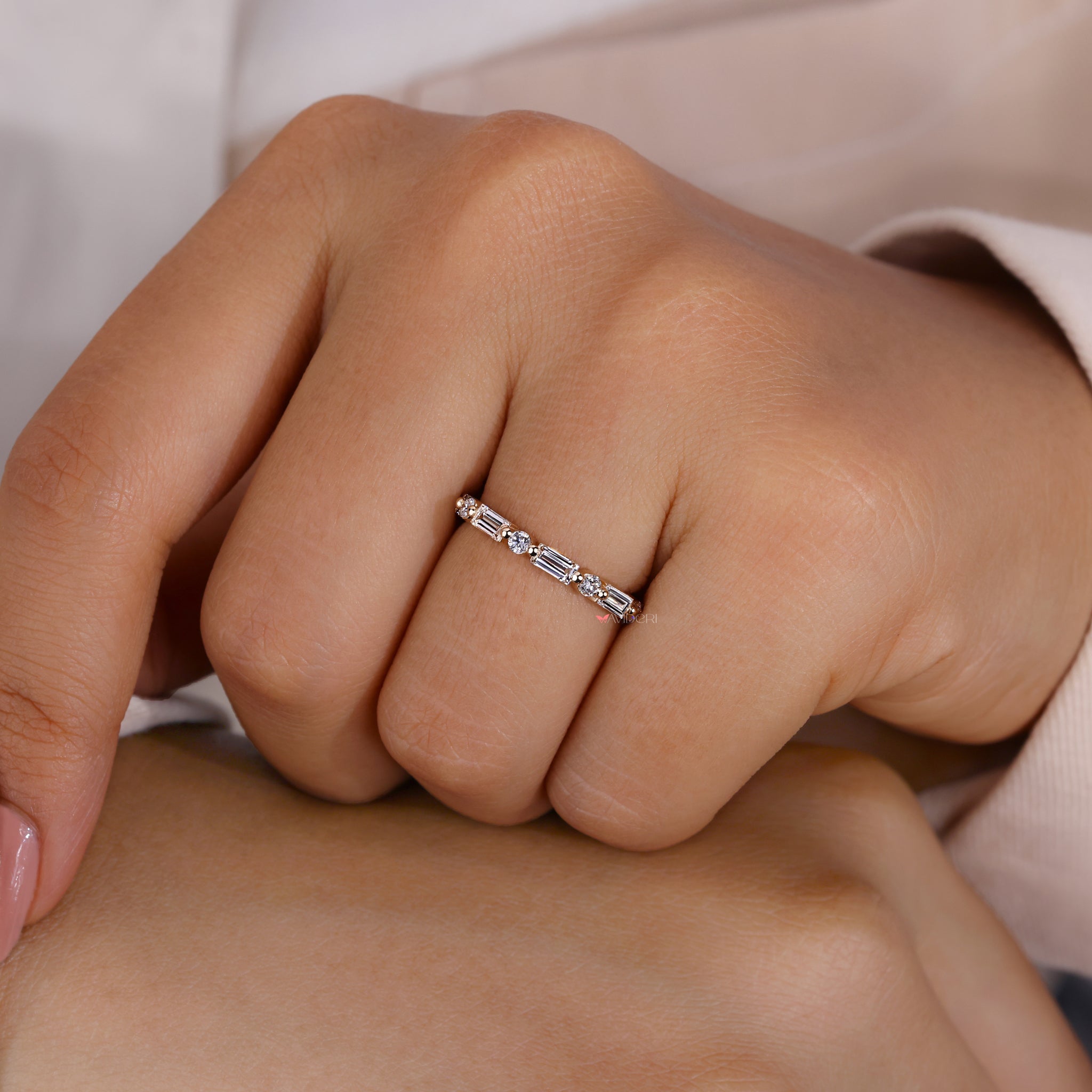 Yellow gold eternity band with lab-grown stones.