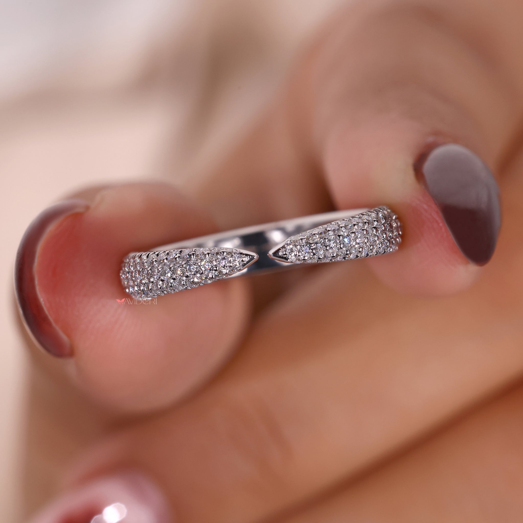 Unique open gap wedding band with diamonds.