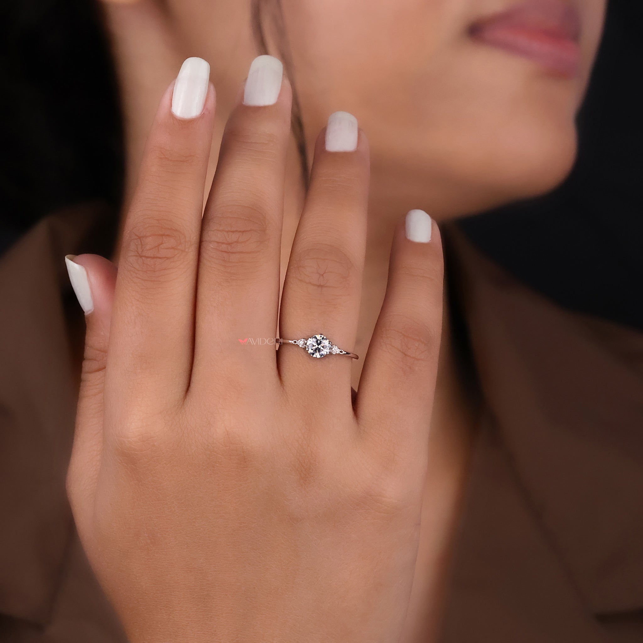 This round cut engagement ring captures brilliance with every angle.