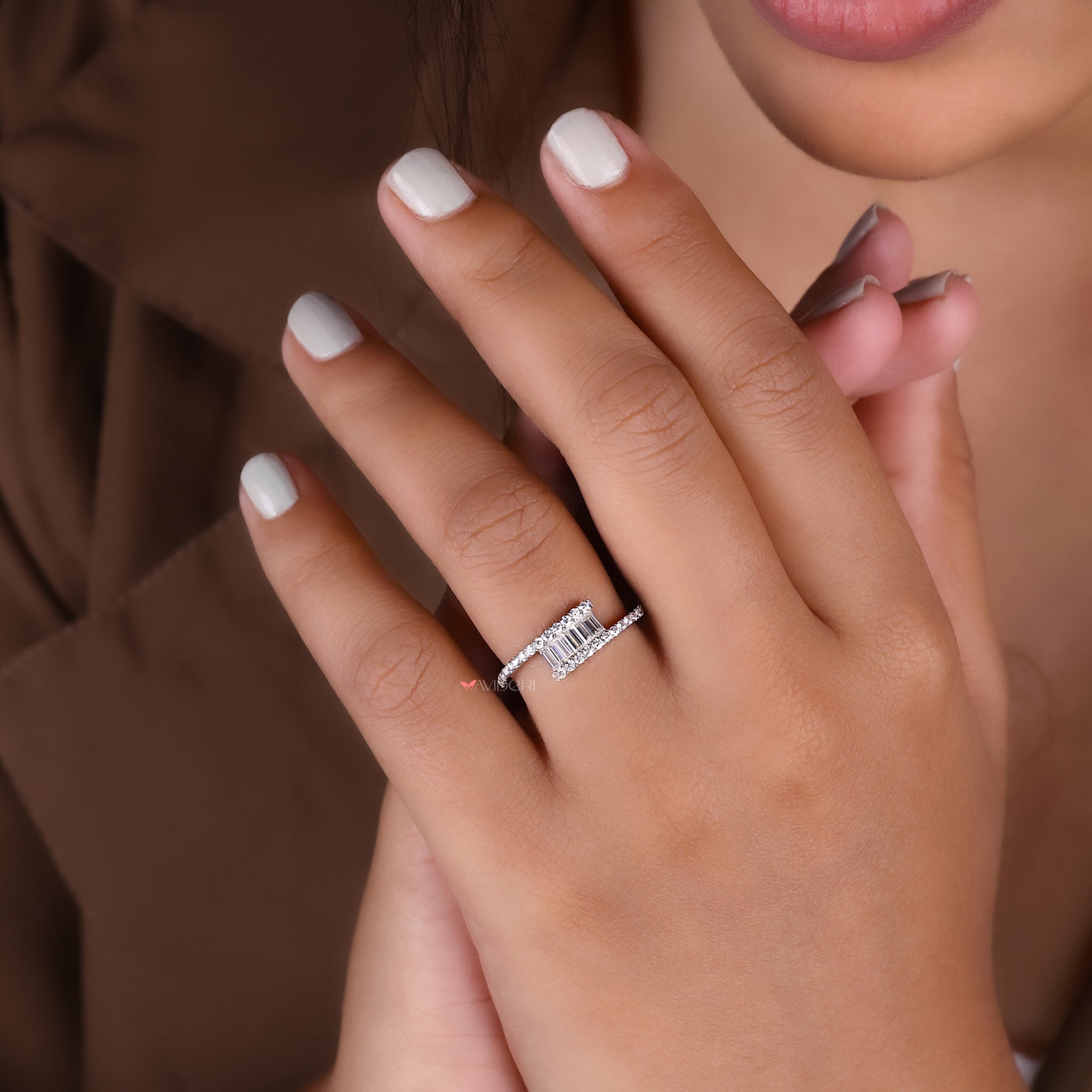 A bypass ring setting with two ends crossing over.