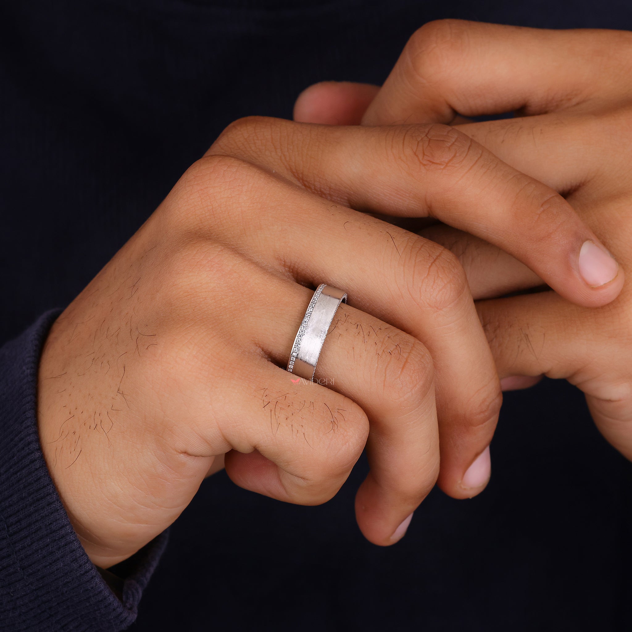 Round diamond wedding ring delivers classic style with sparkling detail.