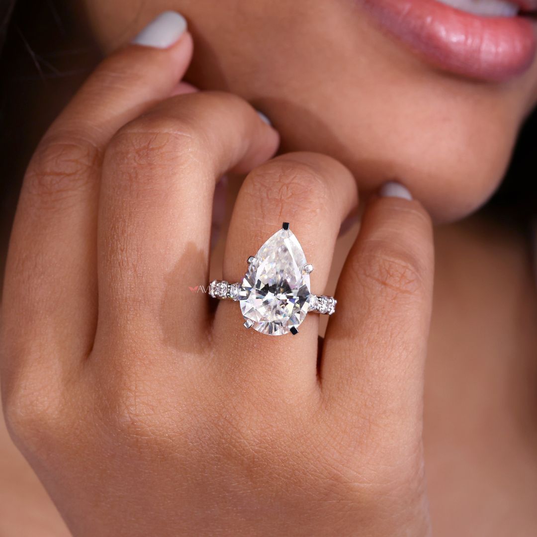 Avideri ring with a pear-shaped center stone.