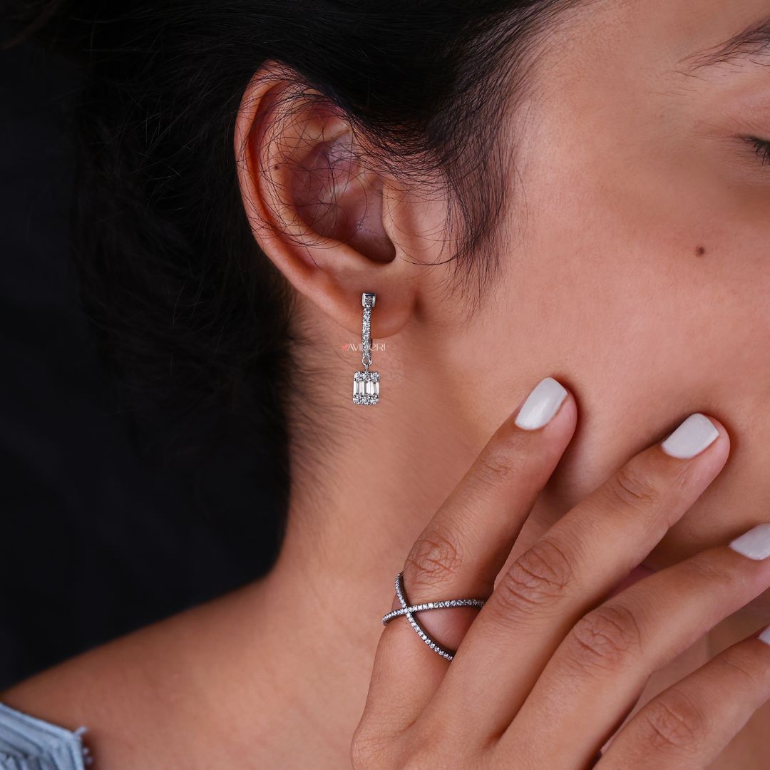 Dangle drop earrings featuring baguette cut Moissanite for an elegant design.