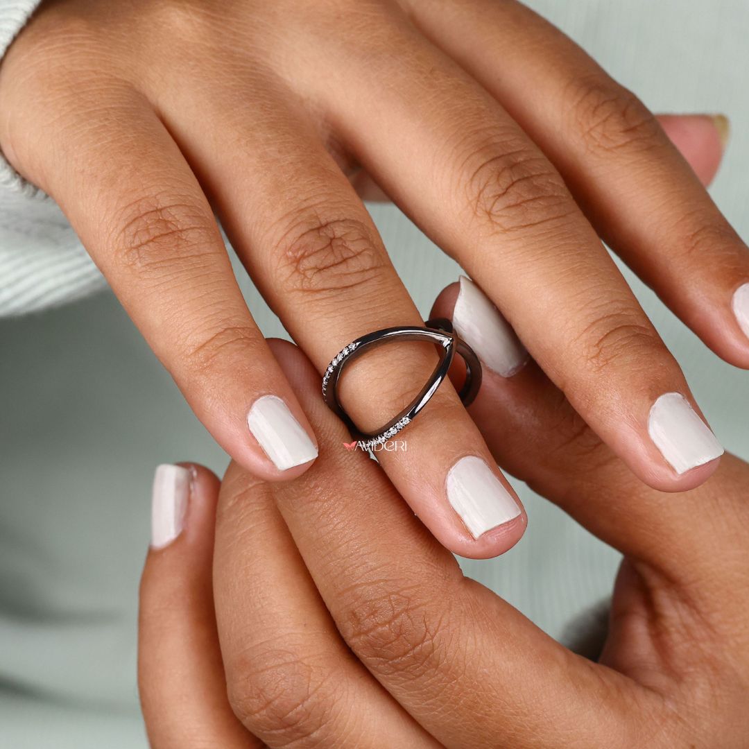 Black wedding band adds a bold contrast and modern aesthetic to your bridal look.