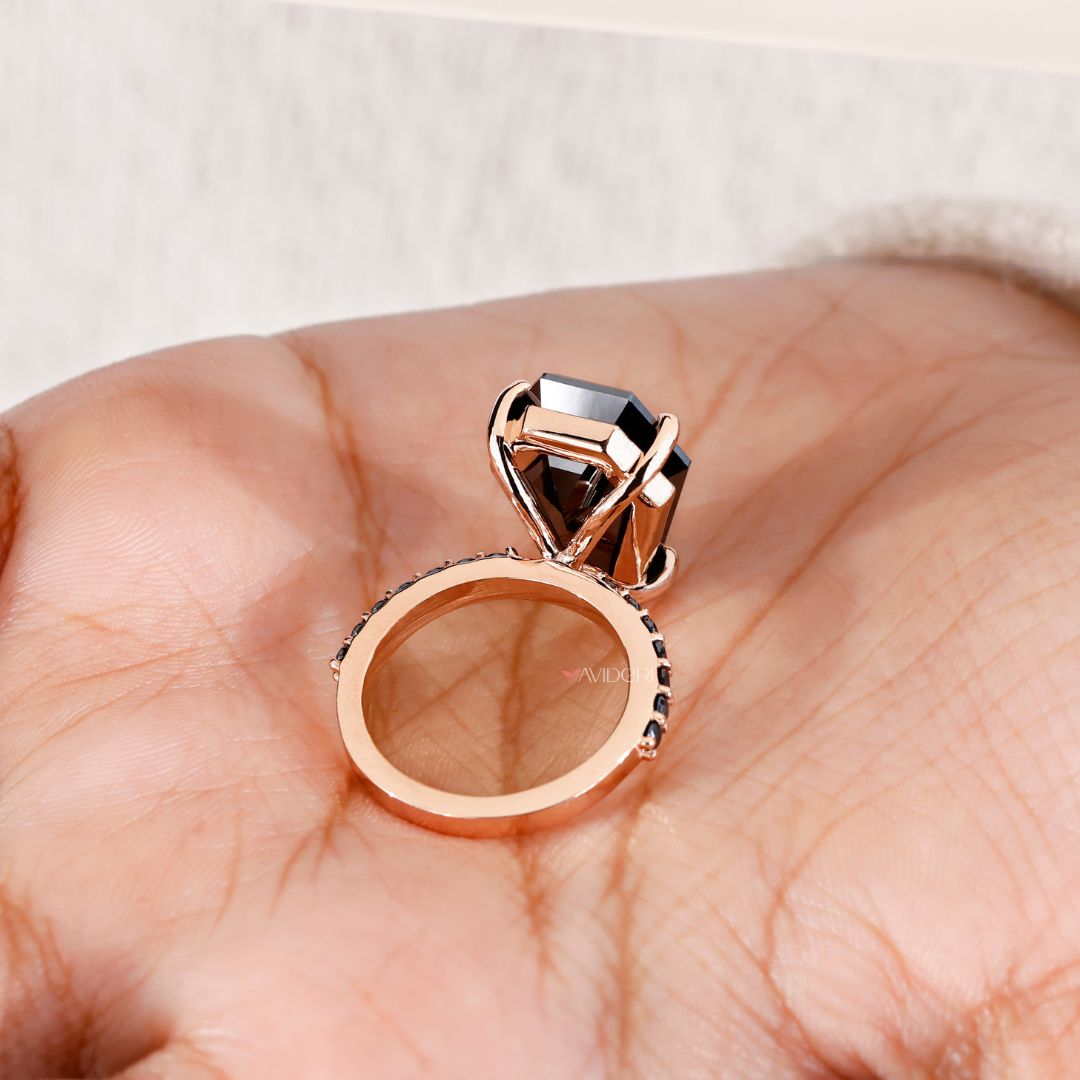 Rose gold engagement ring featuring a unique coffin ring style.