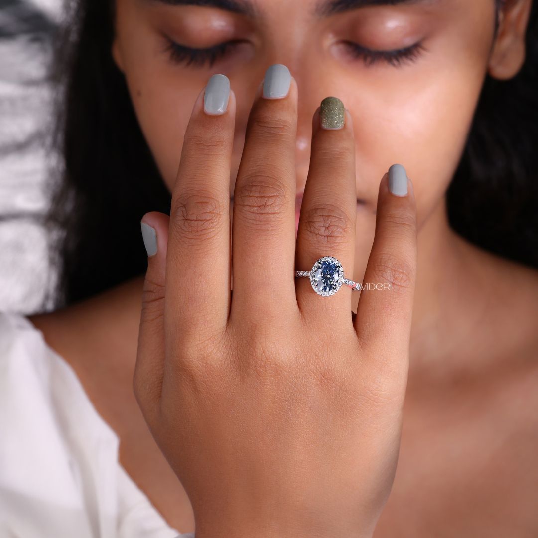 Oval round halo pave set ring with a sparkling halo of diamonds.