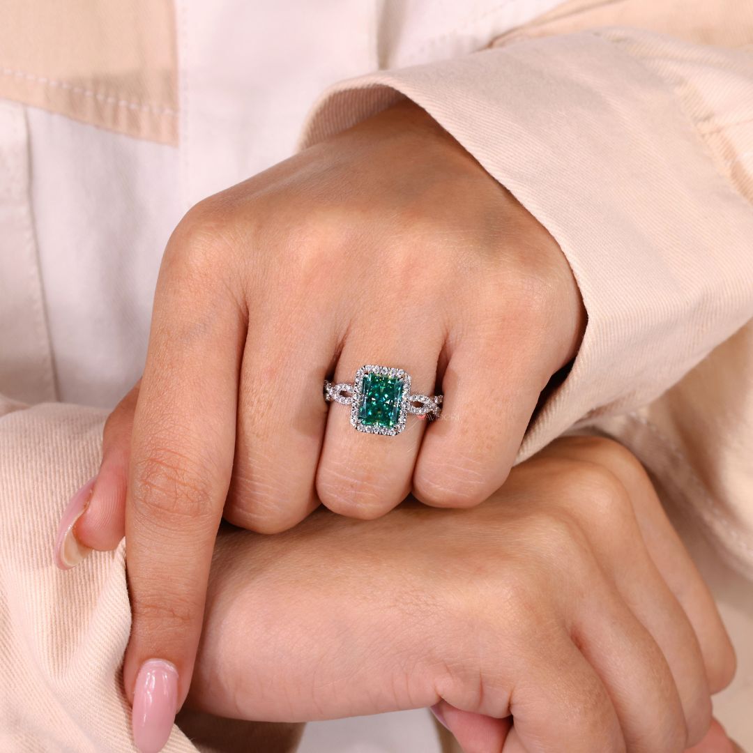 Claw prongs holding a radiant cut moissanite for a modern look.