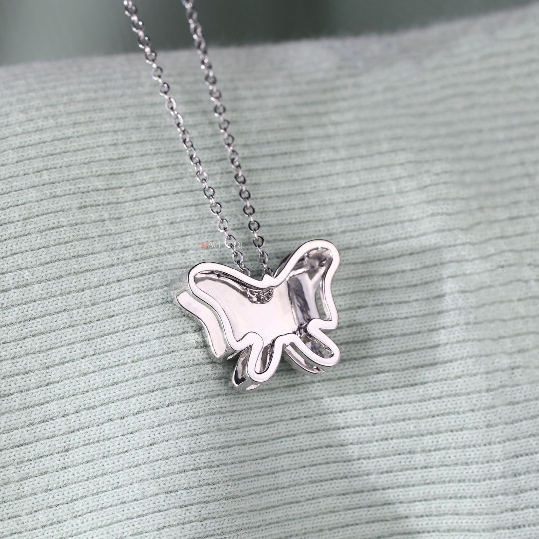 White gold butterfly pendant featuring fine diamond accents