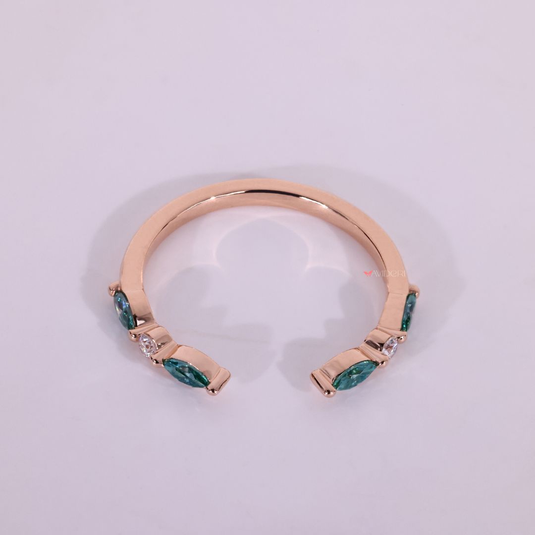 This rose gold moissanite wedding band adds warmth and elegance.