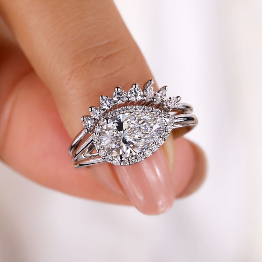 Pear engagement ring with wedding band highlights romantic brilliance in a stunning handcrafted design.
