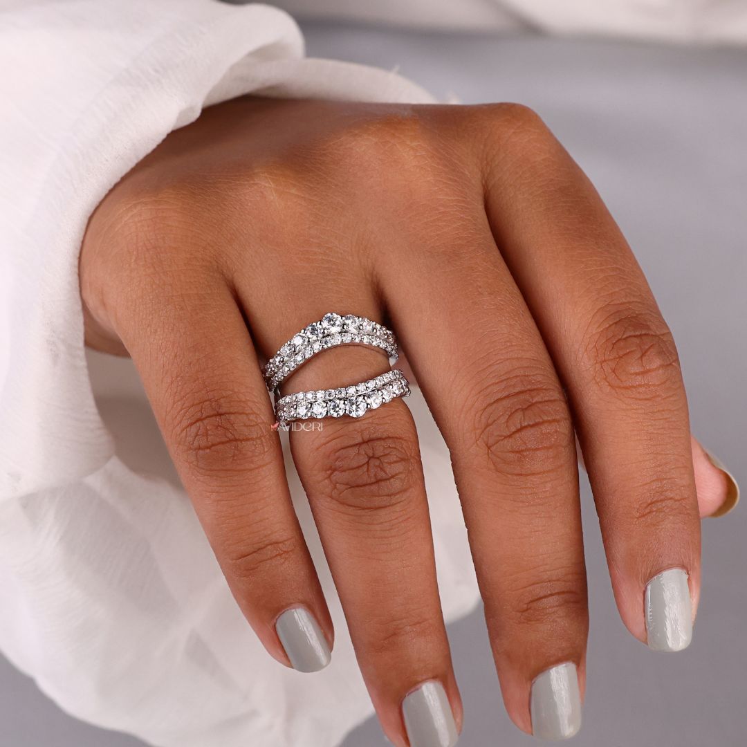 This curved wedding band fits seamlessly with engagement rings.