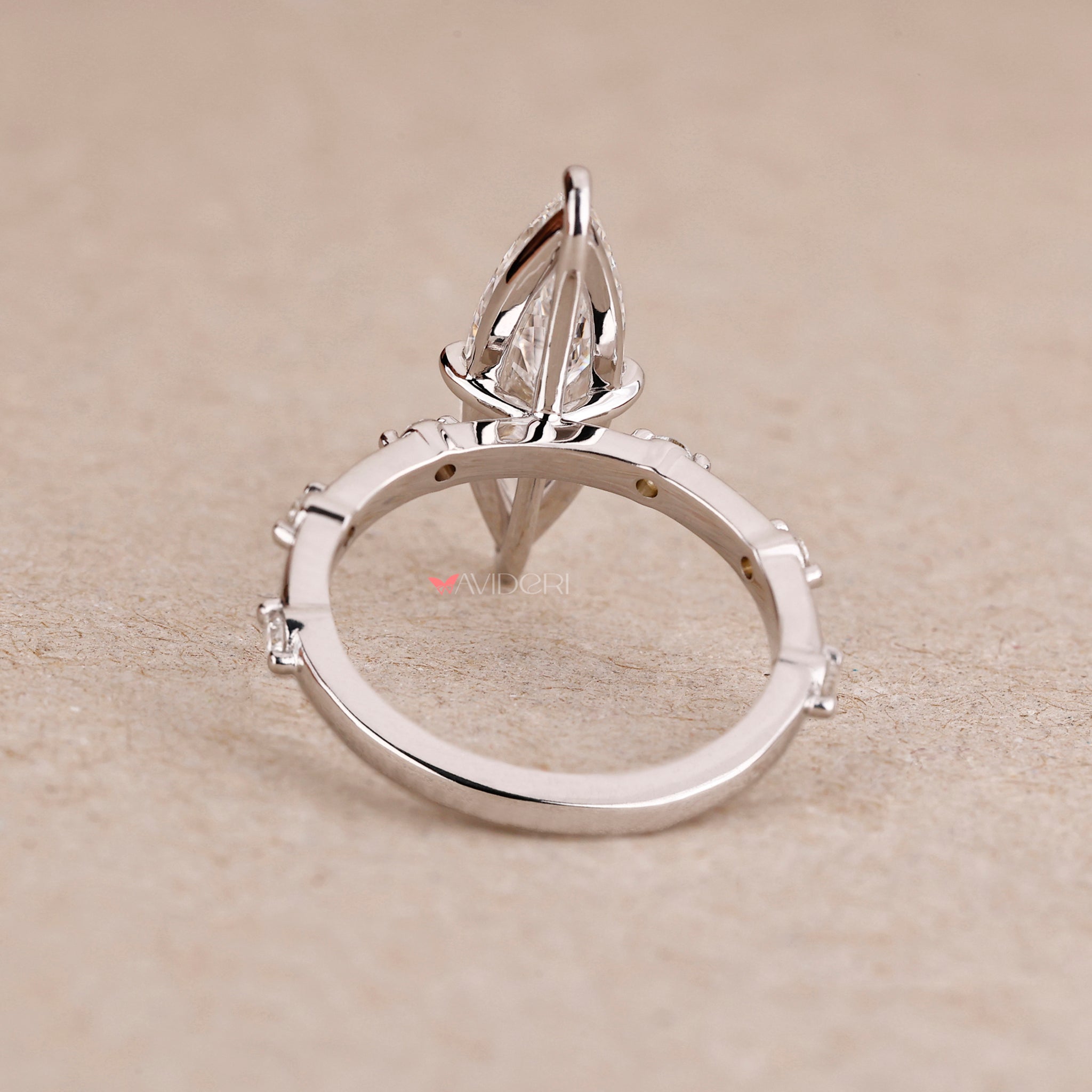 Marquise cut ring with a gold engagement ring.