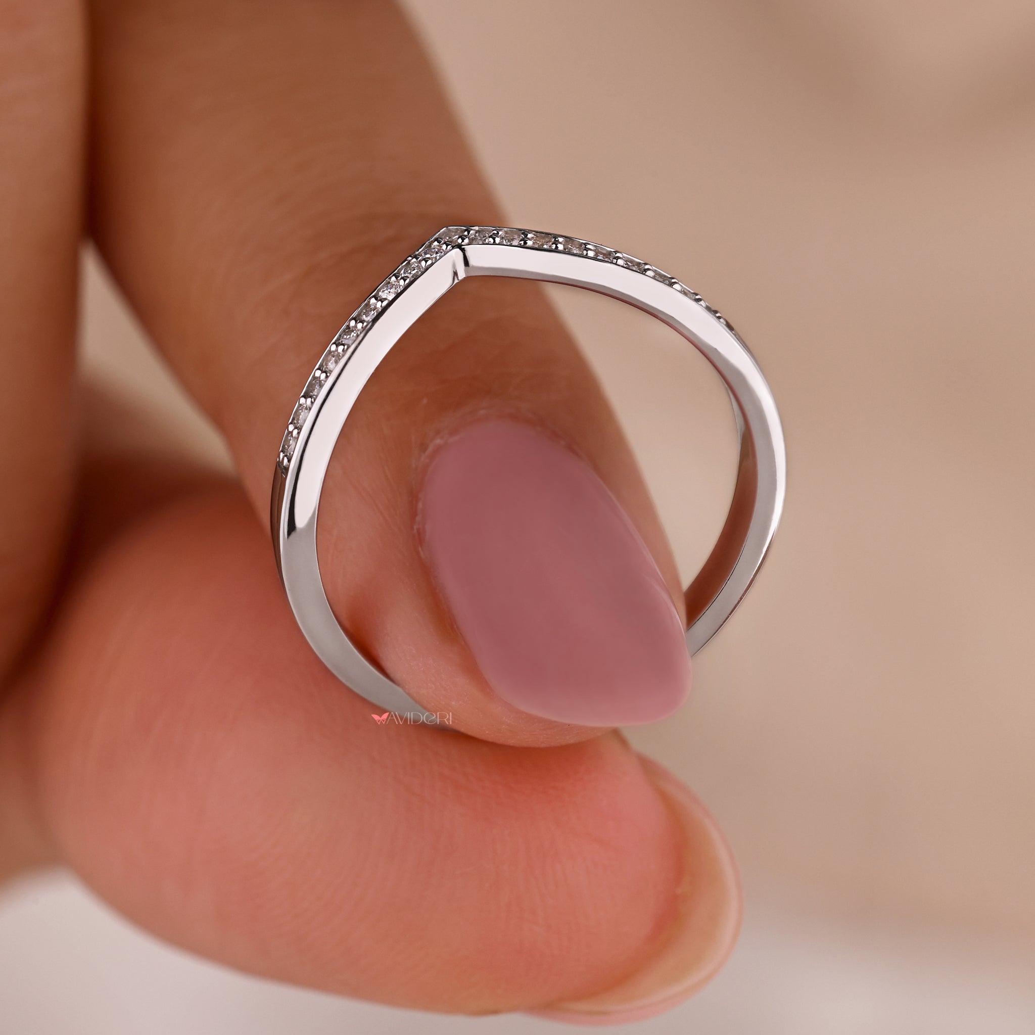 White gold wedding band with diamond accents.