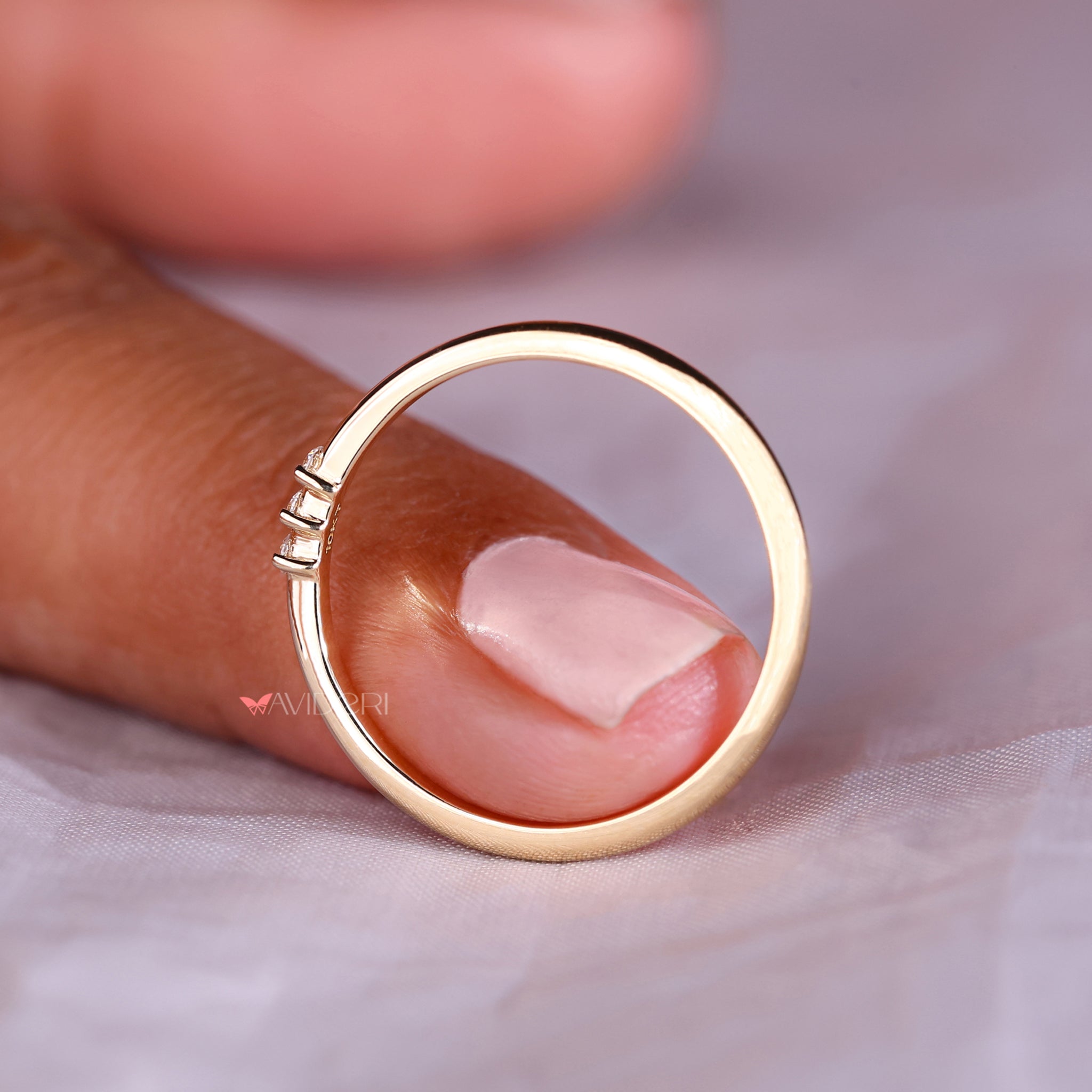 Yellow gold wedding band with a smooth, polished finish.