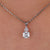 Round cut moissanite pendant set in white gold.
 Round cut moissanite pendant set in white gold.