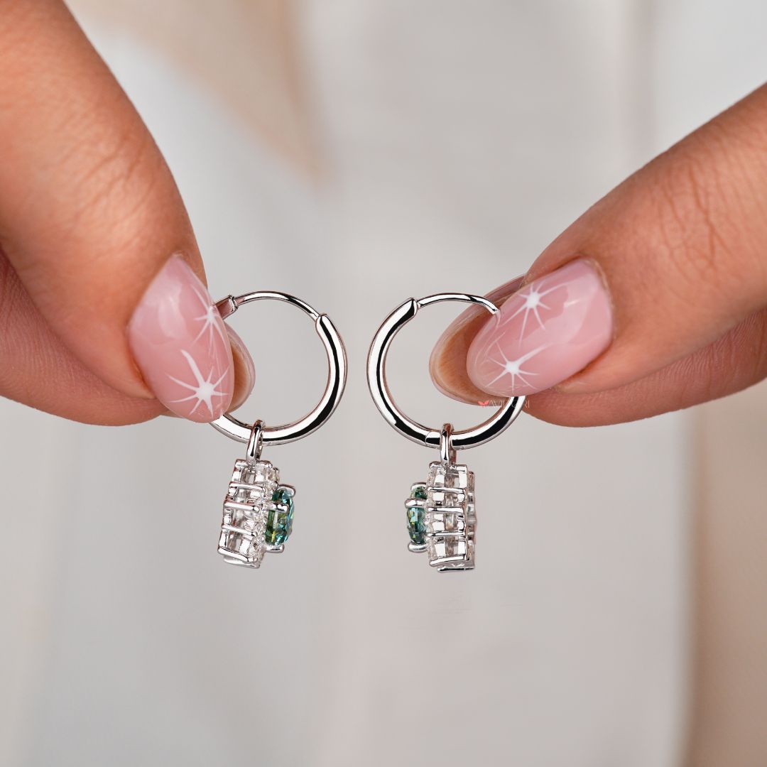 Earrings dangle hoop design for a chic and contemporary statement piece.