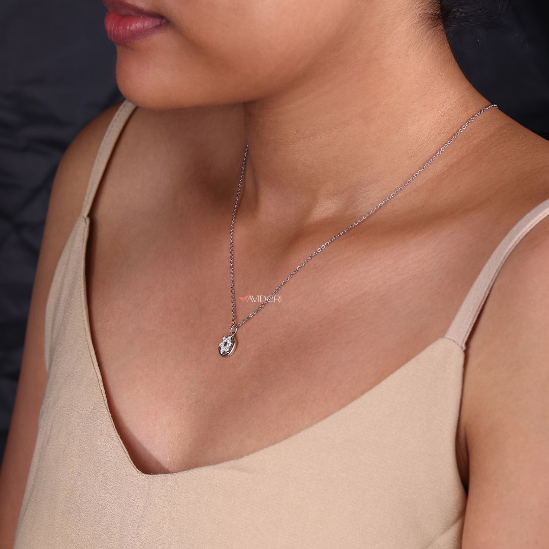 Round diamond pendant shaped like a moon and star