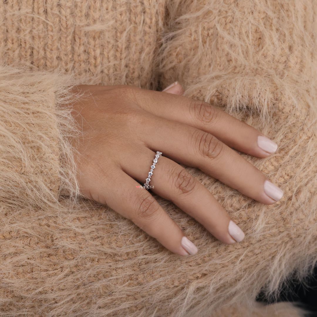 A delicate round wedding band made to complement any engagement ring with a clean, modern look.