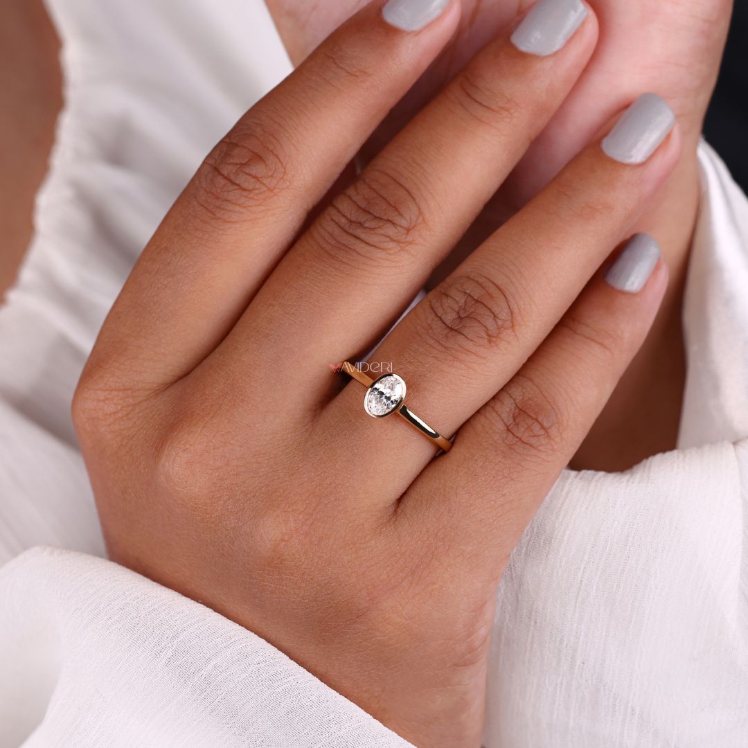 A bezel set engagement ring provides clean lines and secure brilliance.