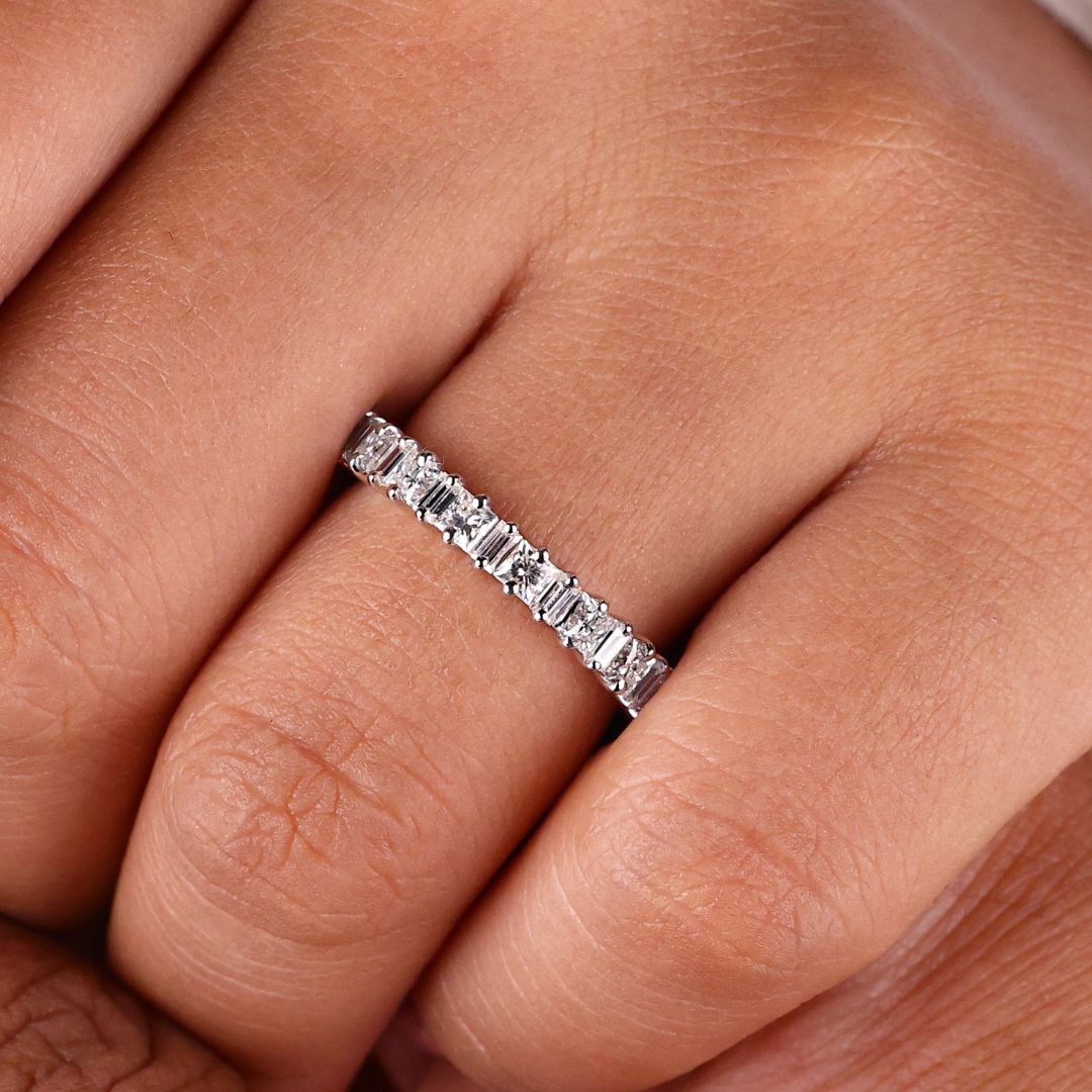 Princess cut wedding band features brilliant symmetry with stunning princess-shaped stones.