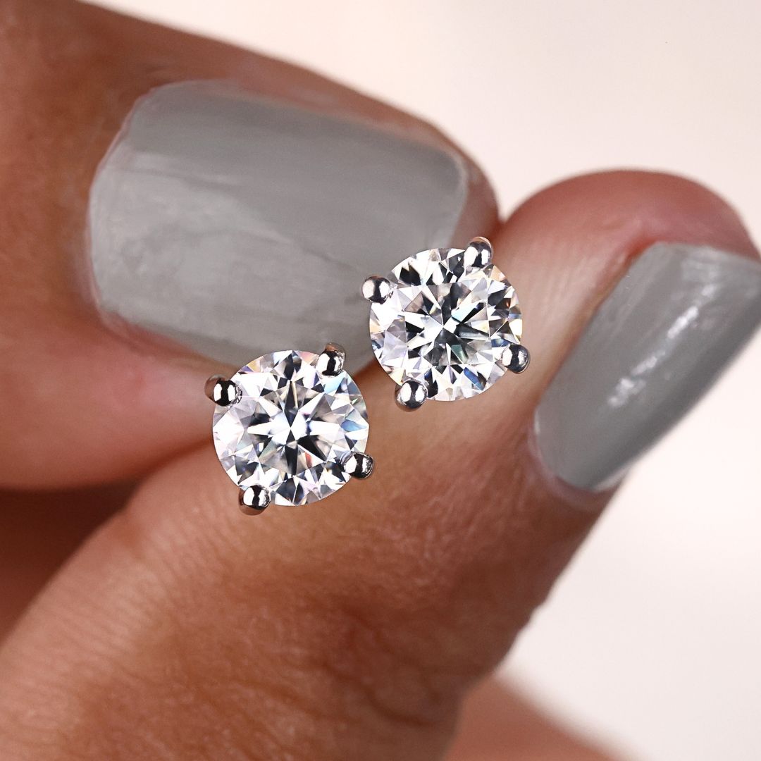 These stunning round moissanite stud earrings are designed to shine bright and catch every glance with their brilliant cut.