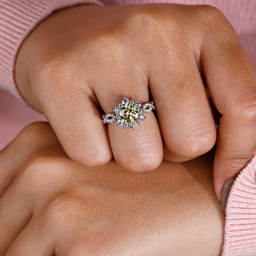 Round engagement ring features a classic shape and bright center stone.