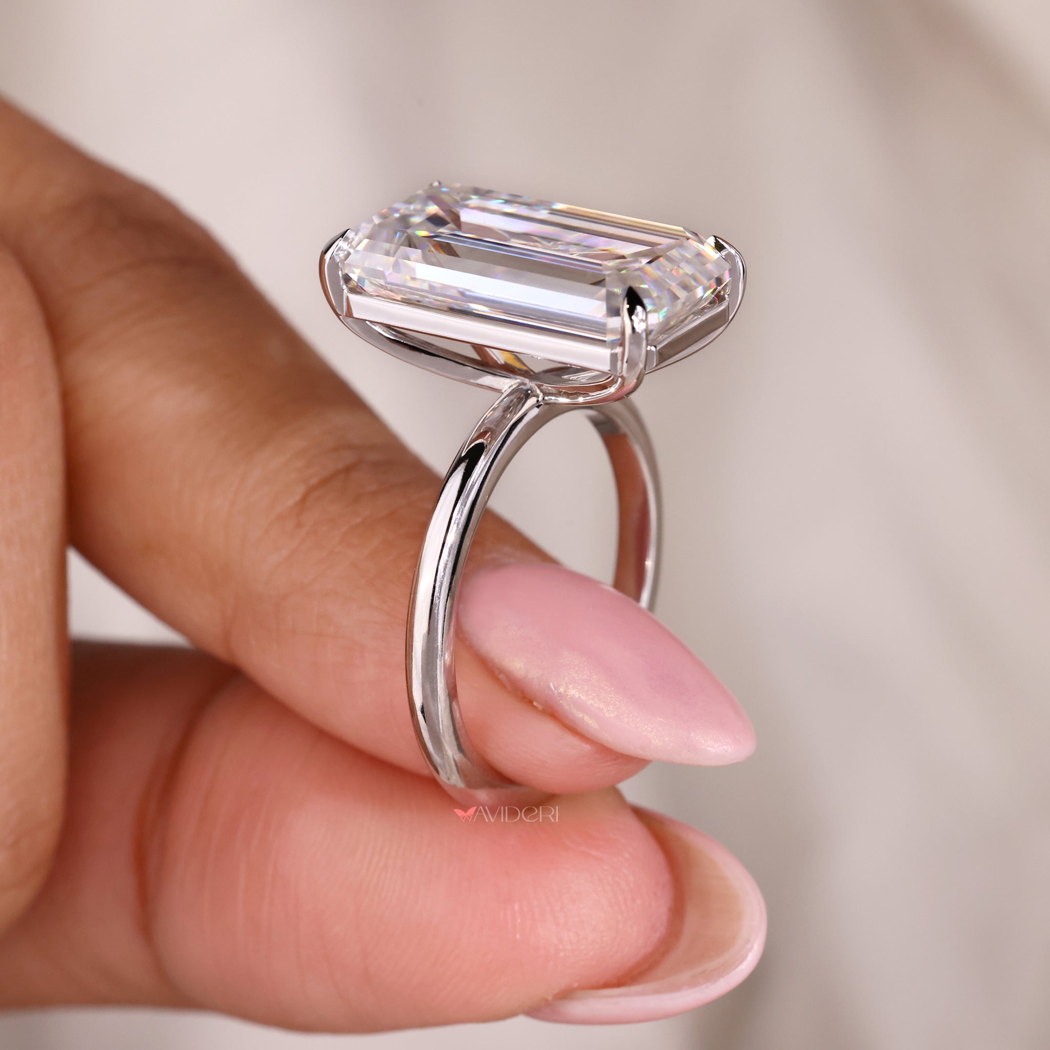 Big moissanite ring designed with a cathedral setting ring.