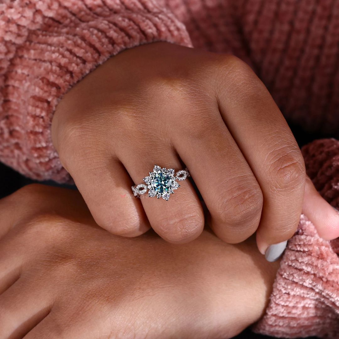 White gold jewellery ring with a round cut engagement ring and halo ring setting.