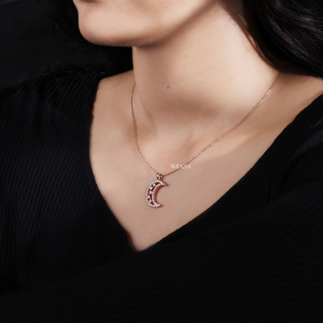 Gold half moon pendant combines warmth and shine for timeless style.