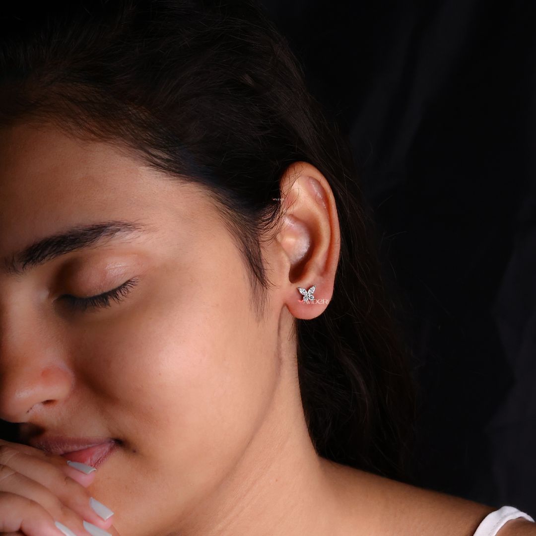 Round Moissanite earrings with marquise cut for a sophisticated butterfly design.