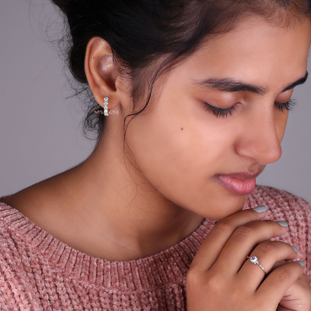 Round stone earrings in a polished gold setting