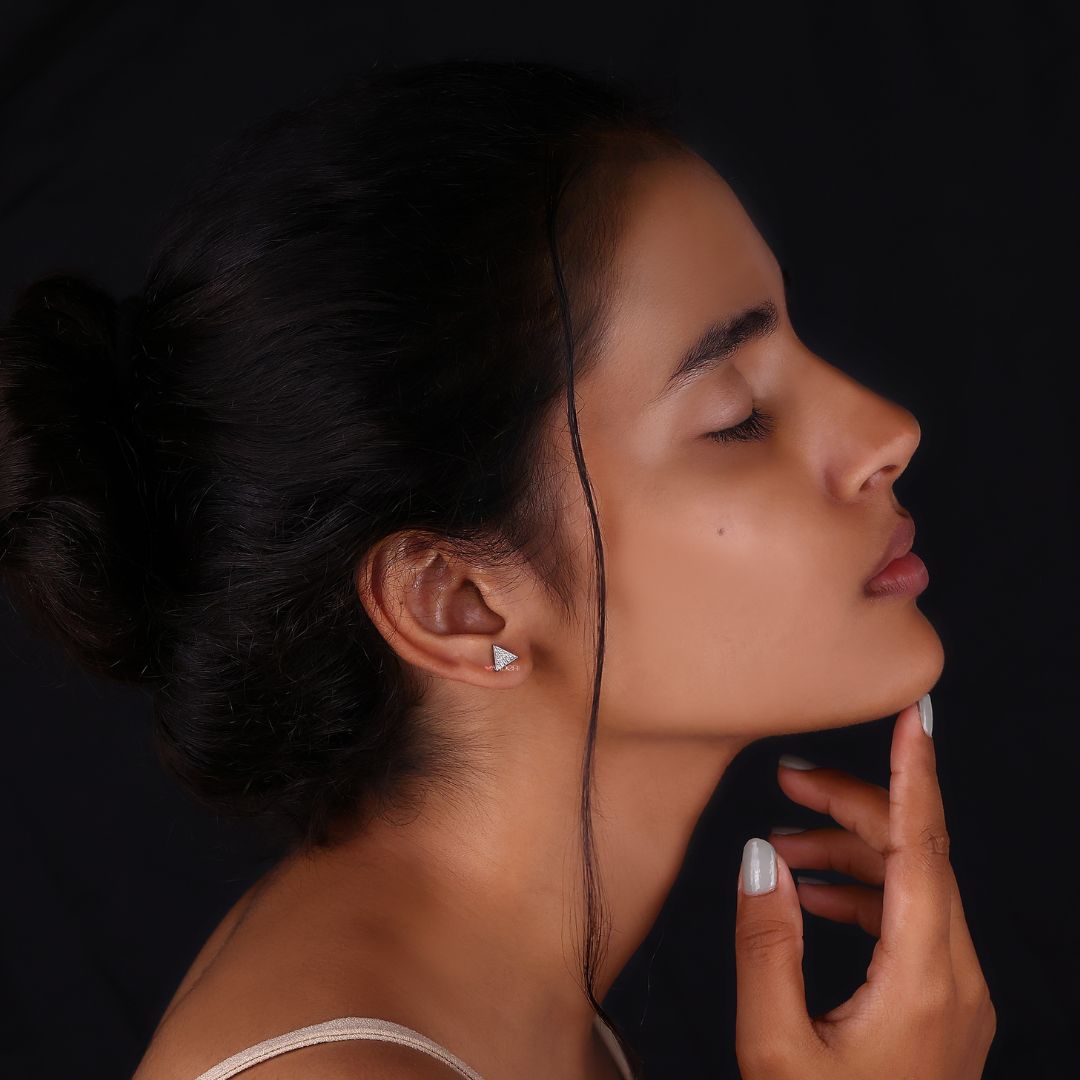 Stud earrings in a unique triangle shape, crafted in white gold.