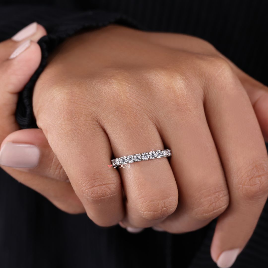 Half eternity wedding band provides comfort and partial sparkle in a lightweight design.