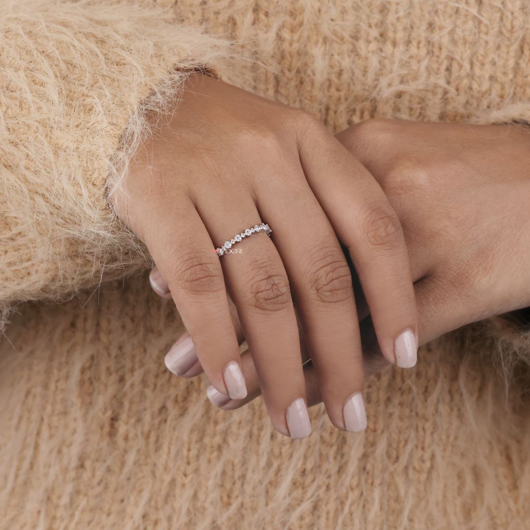 A bold moissanite wedding band created to offer brilliance with durability and affordability.