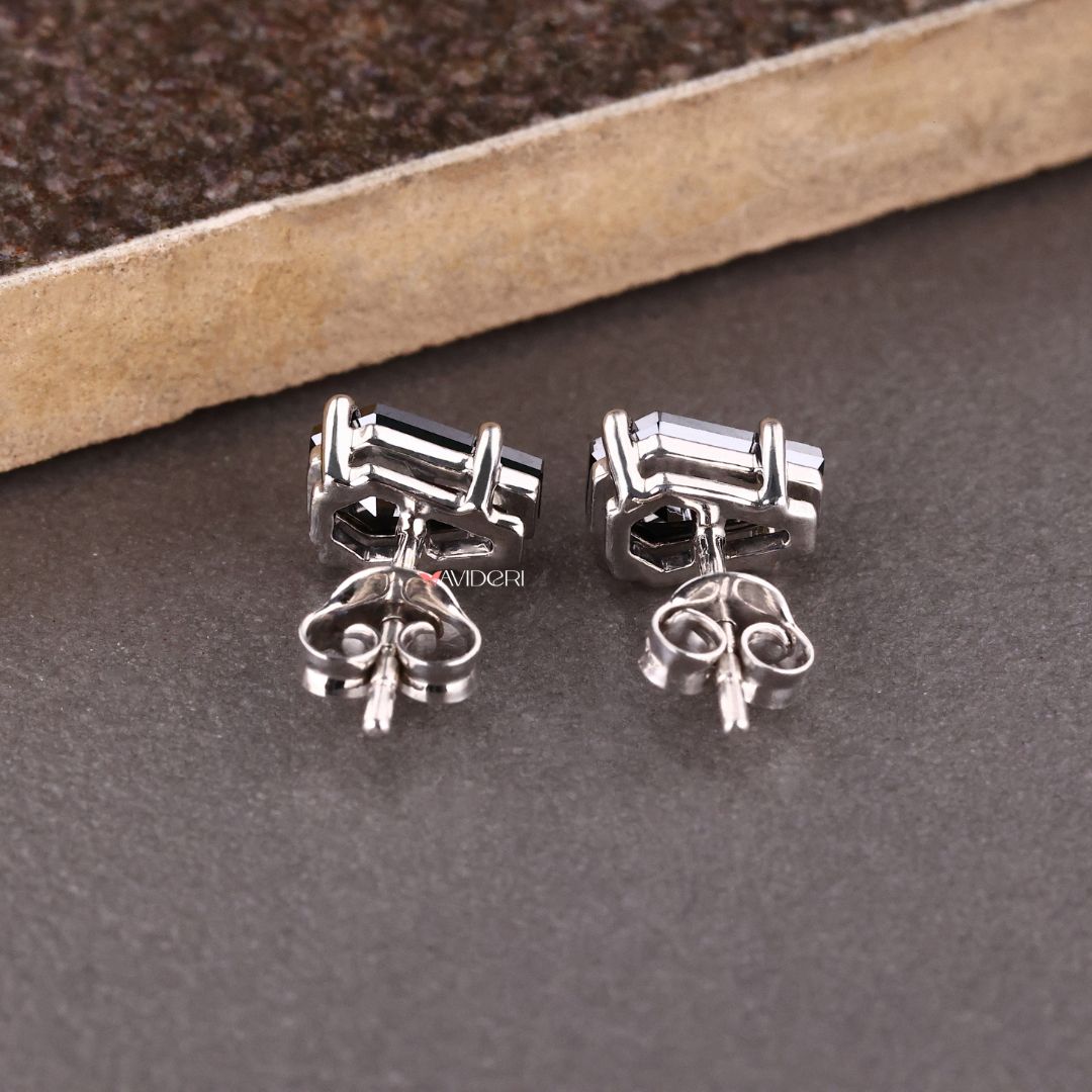 Handmade earrings with a unique coffin earring design and moissanite accents.
