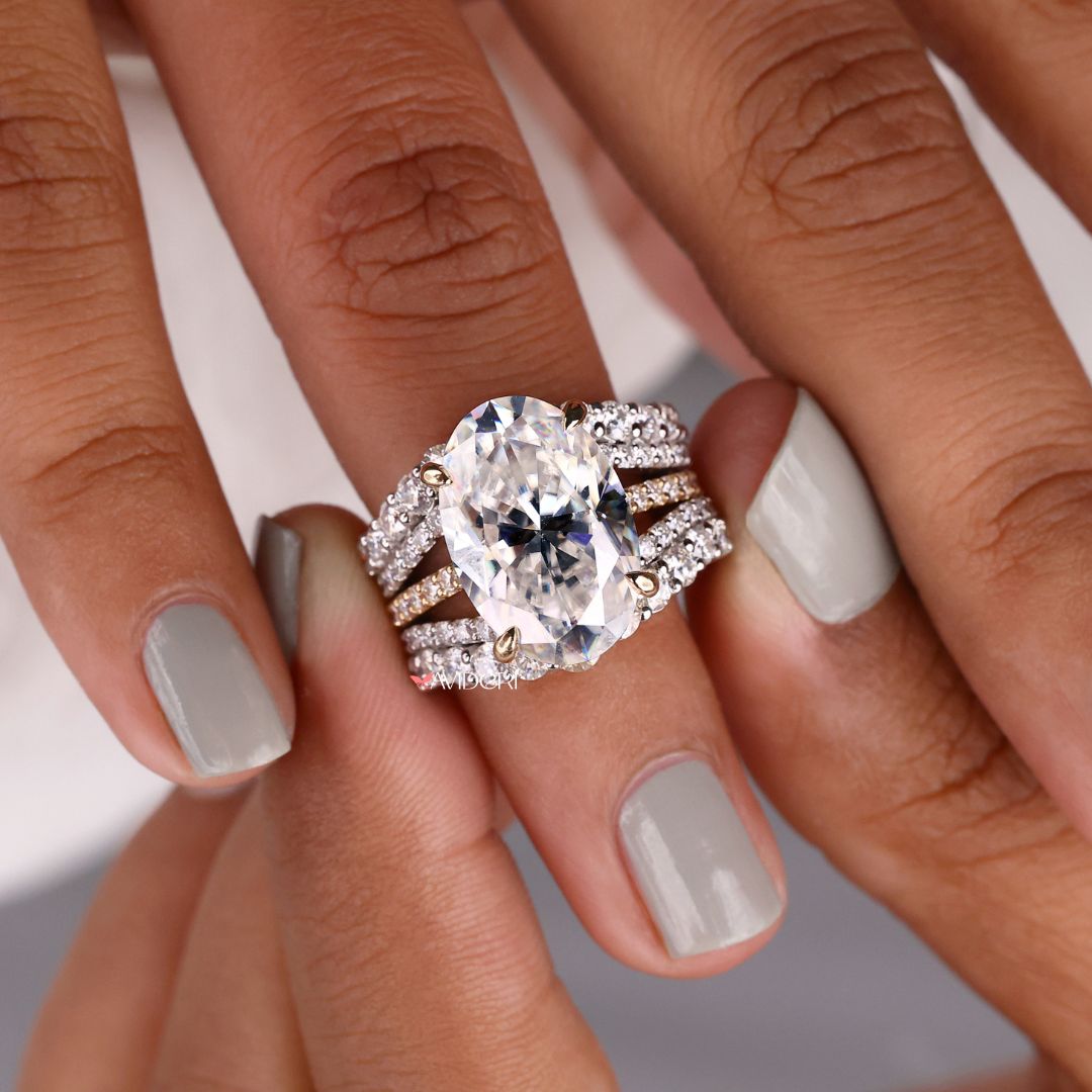 A round moissanite wedding band shines with brilliant sparkle.