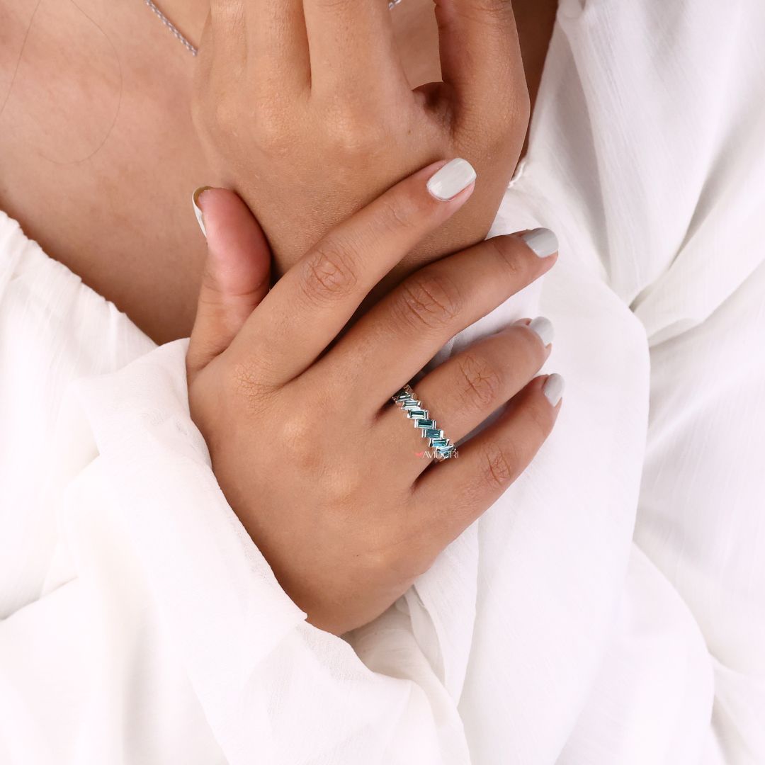 Zig zag wedding band combines playful design with elegant moissanite accents for a unique look.