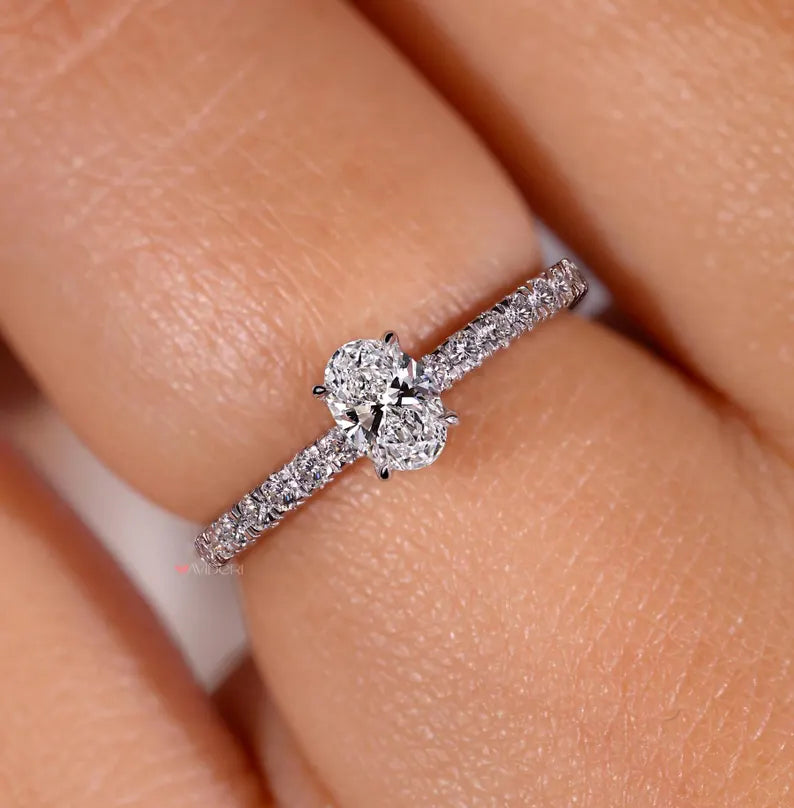 Round cut diamond ring with a 4 prong setting.