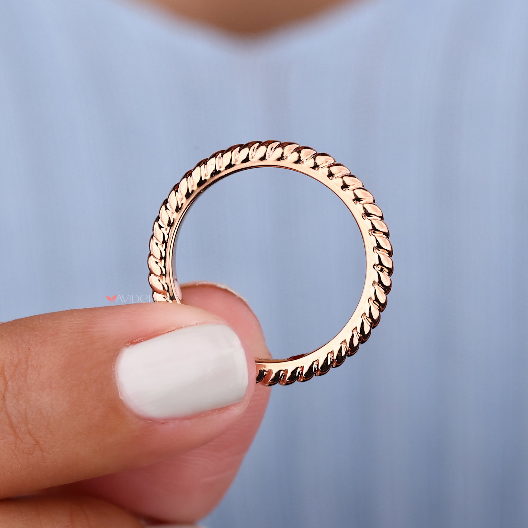 Rose gold wedding band features a warm, radiant glow with a polished finish.